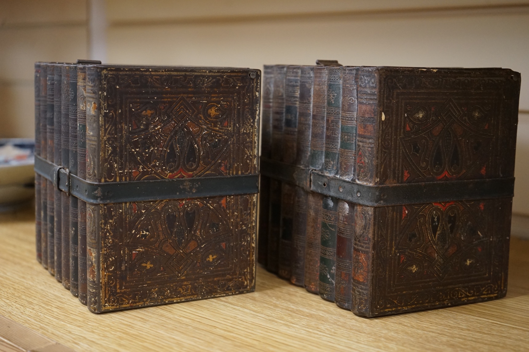 Two Huntley and Palmers novelty biscuit tins, each modelled as a set of books, 16cm